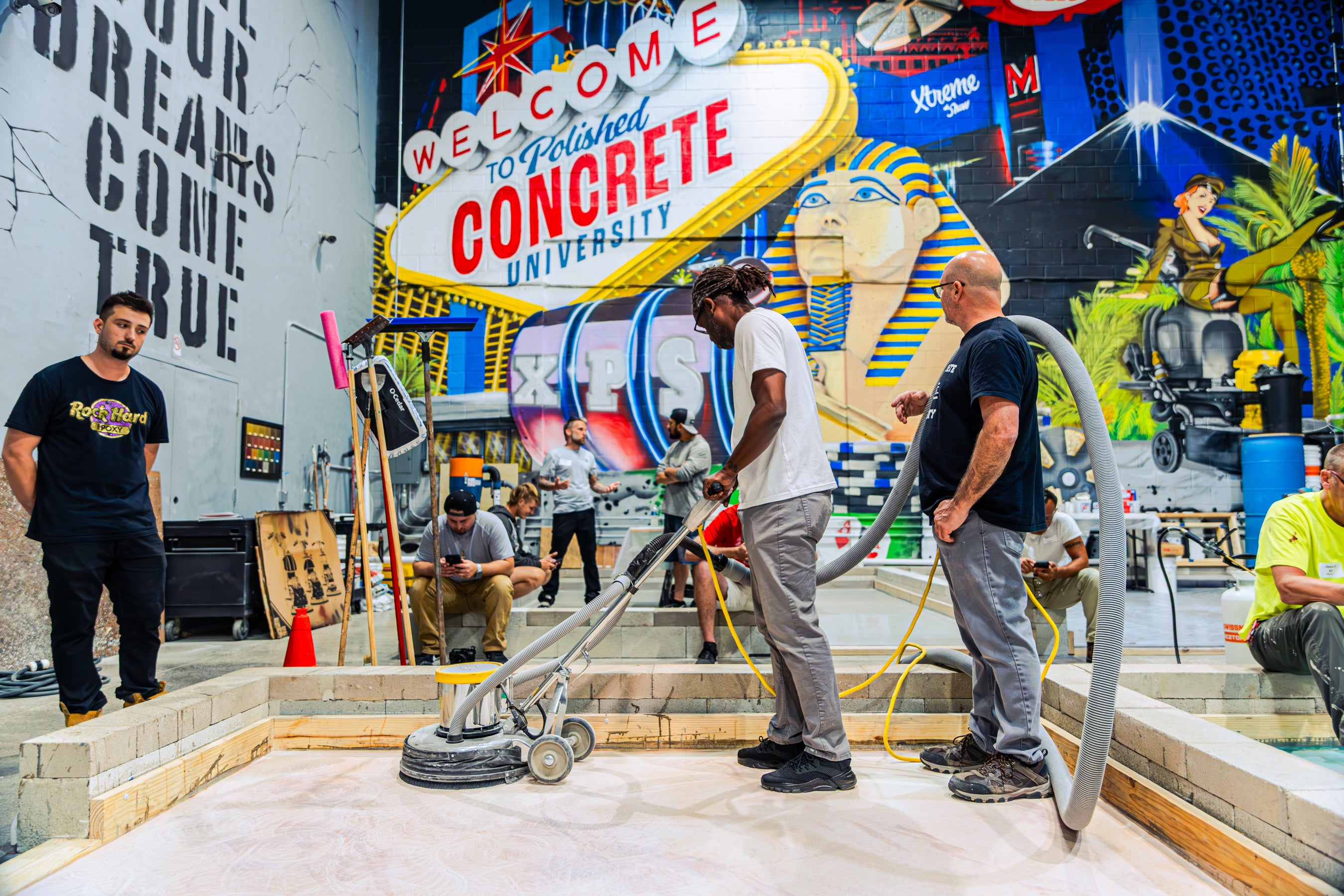 Student using epoxy floor polisher in training class