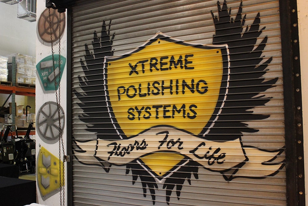 Xtreme Polishing Systems garage door spray painted with logo 