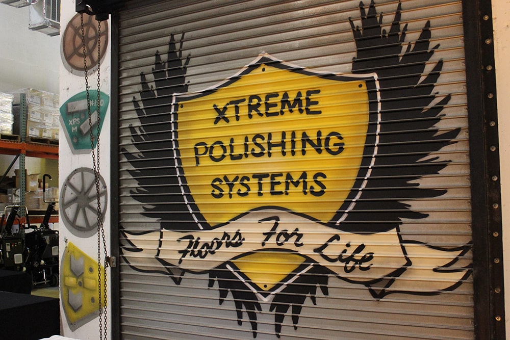 Xtreme Polishing Systems garage door spray painted with logo