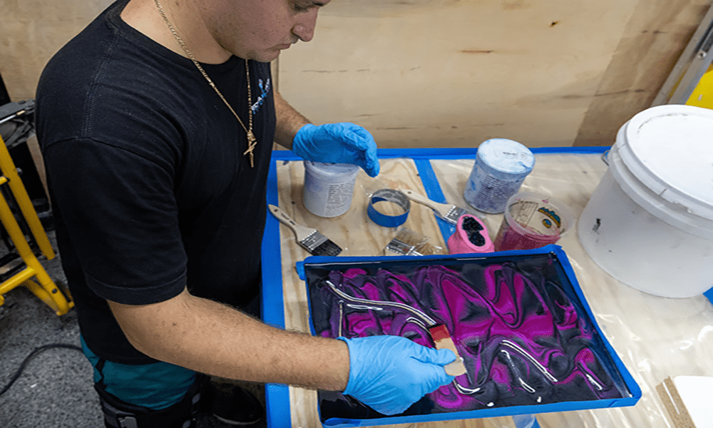 An epoxy resin contractor testing an epoxy resin mix on a slab before installation.