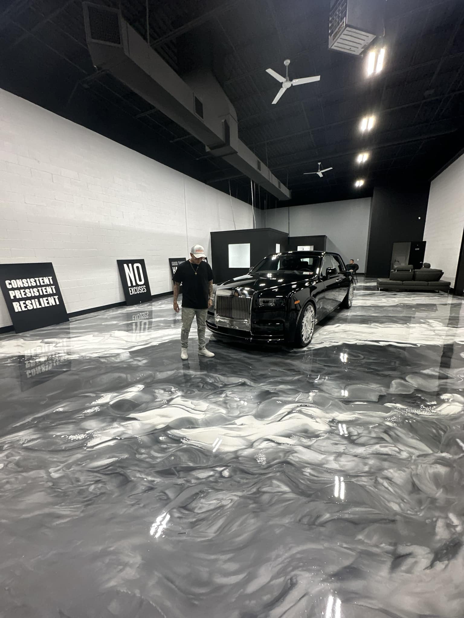 Xtreme Polishing Systems - Silver and White Metallic Floor with Cadillac car.