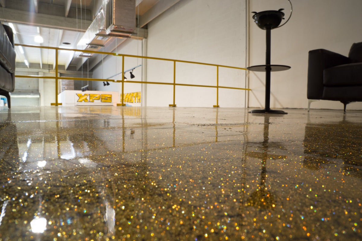 gold glitter epoxy floor inside Xtreme Polishing Systems building