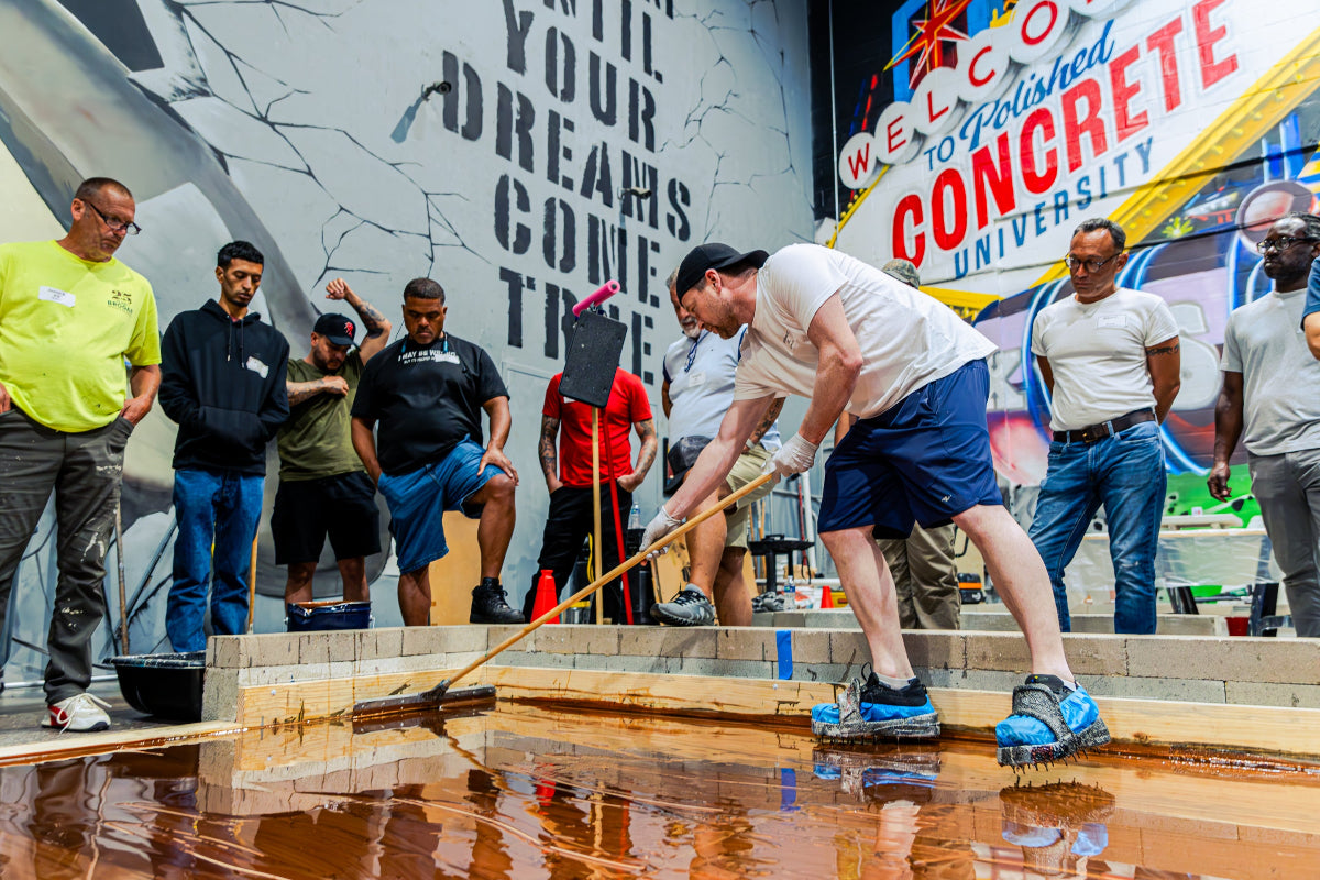 Group of students working on a metallic epoxy floor 