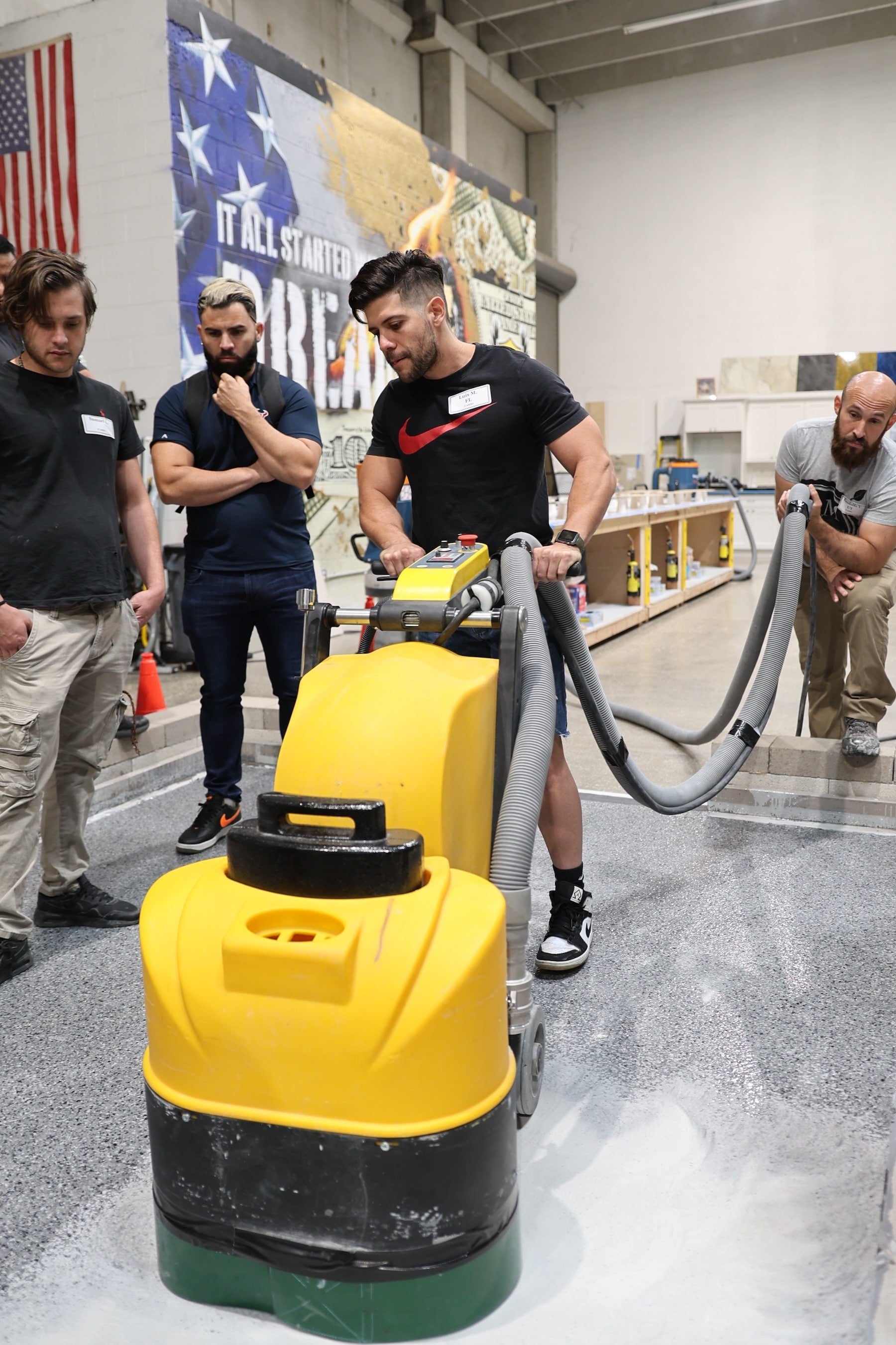 Concrete Grinder: The Concrete Genie demonstration for the grinding of an epoxy flake floor.