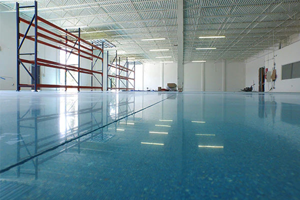 blue epoxy on concrete floor in commercial building | XPS blog cover image
